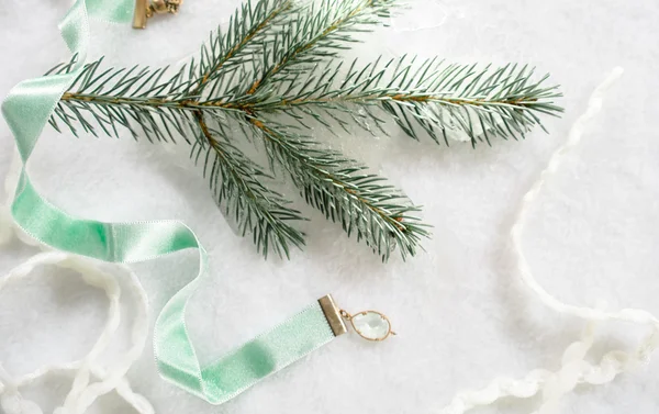 Christmas, new year. Satin ribbon and spruce twigs on a white background. top view — Stock Photo, Image