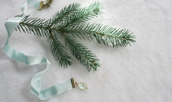 Christmas, new year. Satin blue ribbon and spruce twigs on a white background. top view — Stock Photo, Image