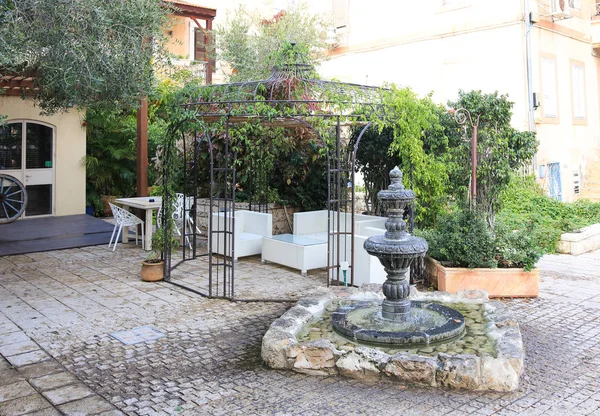 Small fountain and a gazebo in Sderot Ben Gurion in the German colony in Haifa, Israel