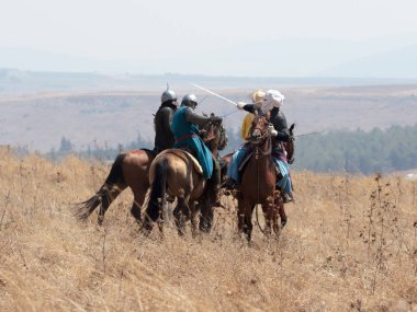 Katılımcılar Hıttin boynuzları, savaşta yeniden inşası 