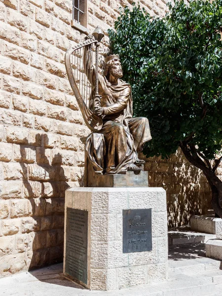 The statue of King David with harp near entrance to his tomb on Mount  Zion in Jerusalem, Israel