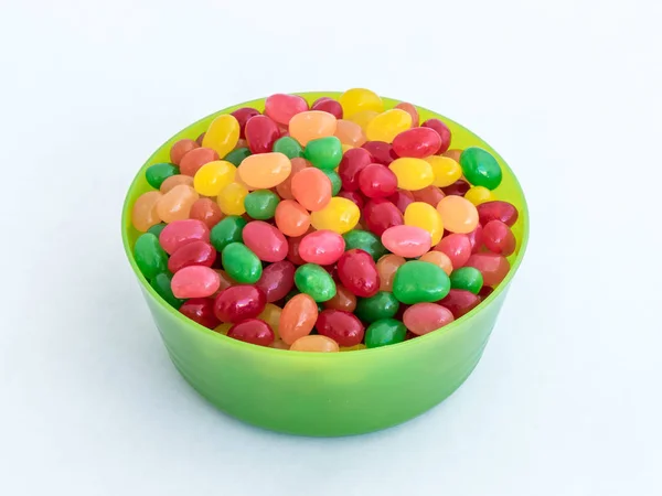 Green plastic round medium size bowl for loose products filled w — Stock Photo, Image