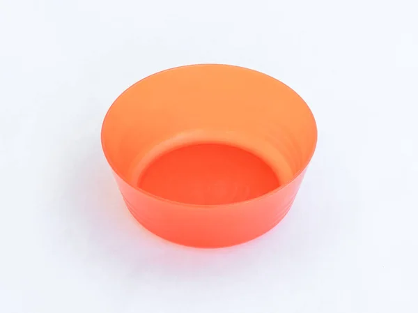 Orange plastic round medium size bowl for loose products isolate — Stock Photo, Image
