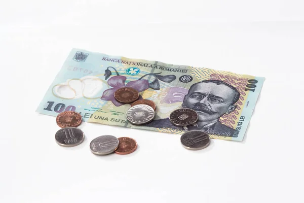 10 と 5 のルーマニア バニ白い背景で隔離の価値があるいくつかのコインで 100 ルーマニア レイの価値がある 1 つの紙幣 — ストック写真
