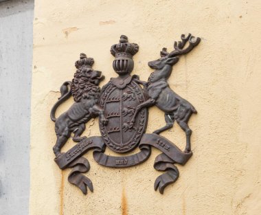 Café La hergeleler (merdiven üzerinde) duvarına arması. Romanya'da Sighisoara şehir