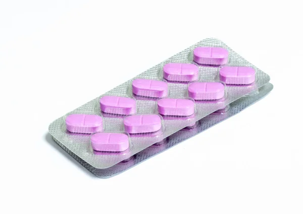 Dos nuevos paquetes de 10 pastillas oblongas de color rosa aisladas sobre un fondo blanco — Foto de Stock