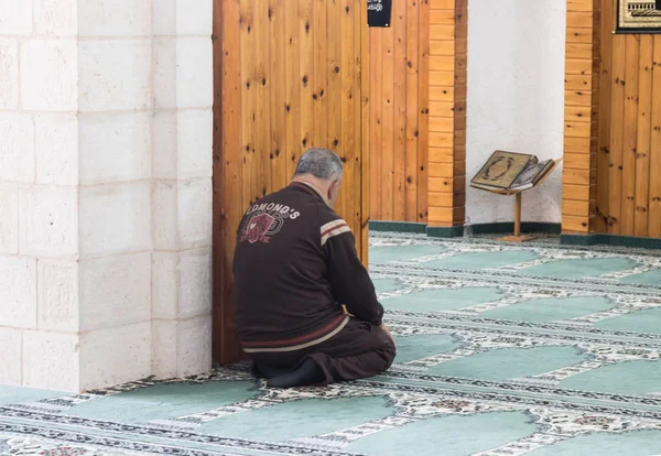 A believing muslim prays in The White Mosque - Al-Abiad in the old city of Nazareth in Israel — Stock Photo, Image