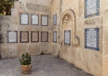 Prayer Our Father in different languages on the walls of the courtyard of the Monastery Carmel Pater Noster located on Mount Eleon - Mount of Olives in East Jerusalem in Israel