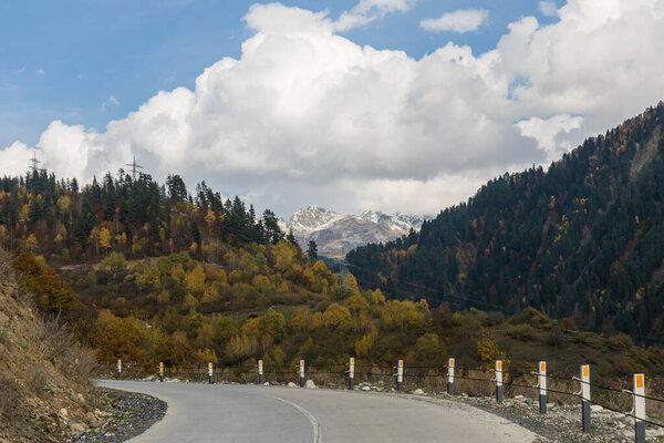 The mountain road runs between the mountains in Svaneti in the mountainous part of Georgia