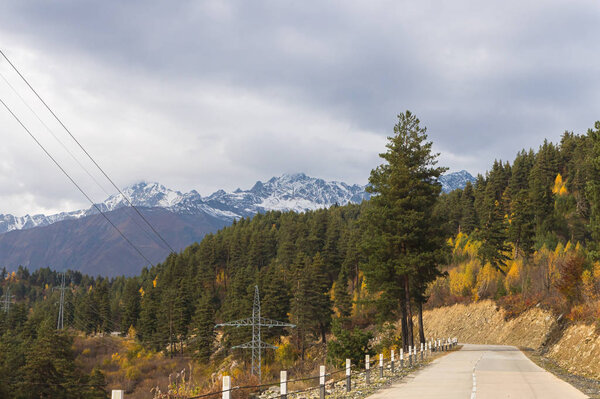 The mountain road runs between the mountains in Svaneti in the mountainous part of Georgia