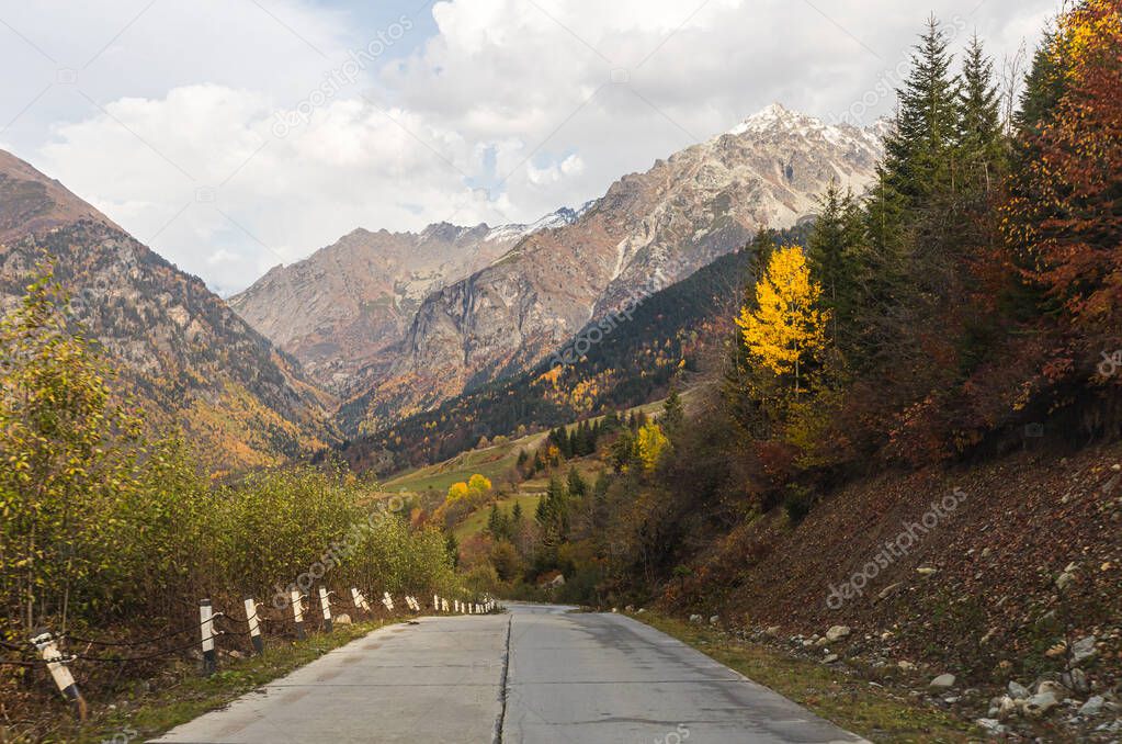 The mountain road runs between the mountains in Svaneti in the mountainous part of Georgia