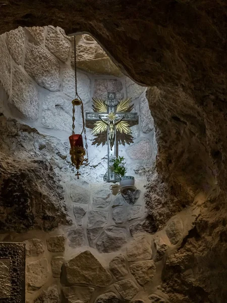 Silver crucifix hanging on the wall in the Milk Grotto Church in Bethlehem in Palestine — 스톡 사진