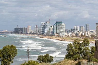 Tel Aviv-Yafo, Israel, February 01, 2020 : View of the Yafo promenade, high-rise buildings of Tel Aviv on the shore and the Mediterranean coast from the Yafo embankment in old Yafo in Israel