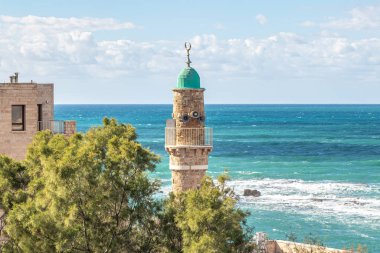 Tel Aviv-Yafo, Israel, February 01, 2020 : The upper part of the Al Bahr Mosque on the background of the Mediterranean Sea on the promenade in old Yafo in Israel