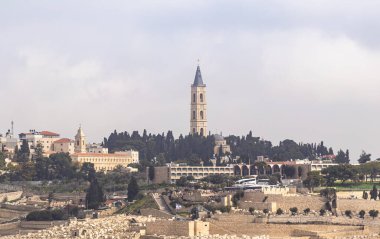 Jerusalem, Israel, February 29, 2020 : View of the old city of Jerusalem, jewish cemetery and the The Russian Church on Mount Eleon from the Abu Tor district of Jerusalem city in Israel
