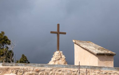 Jerusalem, Israel, February 29, 2020 : The large metal cross on the roof of the abandoned Greek Orthodox Church at the end of the street in the old district of Jerusalem city in Israel