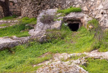 Jerusalem, Israel, February 29, 2020 : Ritual cave for burial in the Gey Ben Hinnom Park - called in the Holy Books as the Blazing Inferno in Jerusalem city in Israel