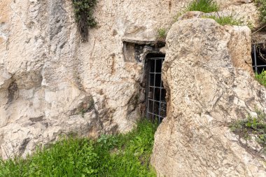 Jerusalem, Israel, February 29, 2020 : Ritual cave for burial in the Gey Ben Hinnom Park - called in the Holy Books as the Blazing Inferno in Jerusalem city in Israel