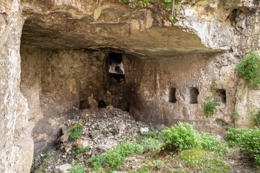 Jerusalem, Israel, February 29, 2020 : Ritual cave for burial in the Gey Ben Hinnom Park - called in the Holy Books as the Blazing Inferno in Jerusalem city in Israel