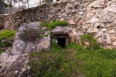 Jerusalem, Israel, February 29, 2020 : Ritual cave for burial in the Gey Ben Hinnom Park - called in the Holy Books as the Blazing Inferno in Jerusalem city in Israel