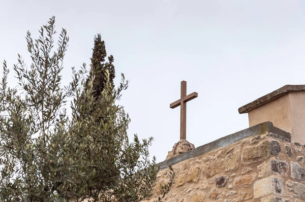 Jerusalem, Israel, February 29, 2020 : The large metal cross on the roof of the abandoned Greek Orthodox Church at the end of the street in the old district of Jerusalem city in Israel