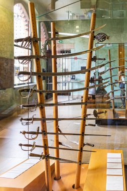 Milan, Italy, 29 September, 2015 : The stand with piercing and chopping weapons - exhibit at the museum of the Sforzesco Castle - Castello Sforzesco in Milan, Italy