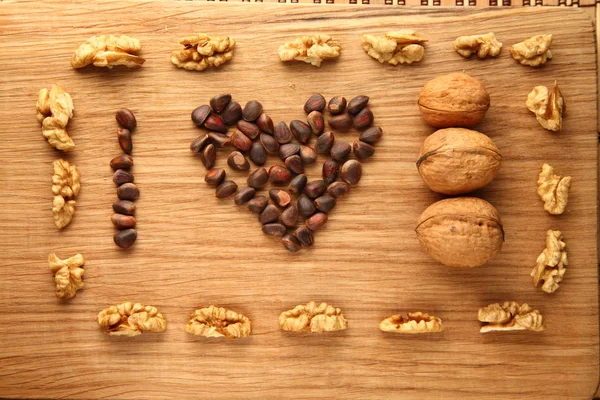 Walnut and pine nuts on a cutting board