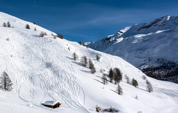 Houses on the hillside against the backdrop of mountain peaks. Zermatt Ski Resort Switzerland