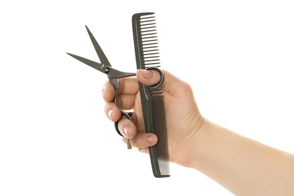 Color comb and scissors in hand — Stock Photo, Image