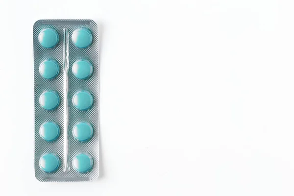 Blue Pills packed in blister isolated on white — Stock Photo, Image