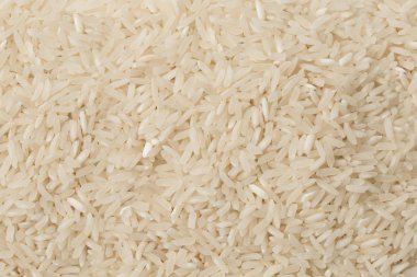 Arka plan olarak dokulu çiğ beyaz basmati pirinç