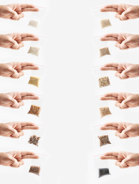Set of hand holding Plastic transparent zipper bags with full of premium groats isolated on white, Vacuum packages with pasta, peas, groats, rice, seeds, semolina, sugar, flakes. Concept.