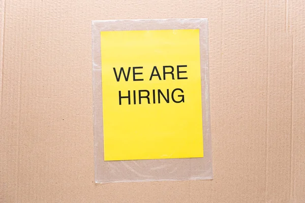 We are hiring printed on yellow paper on transparent plastic bag