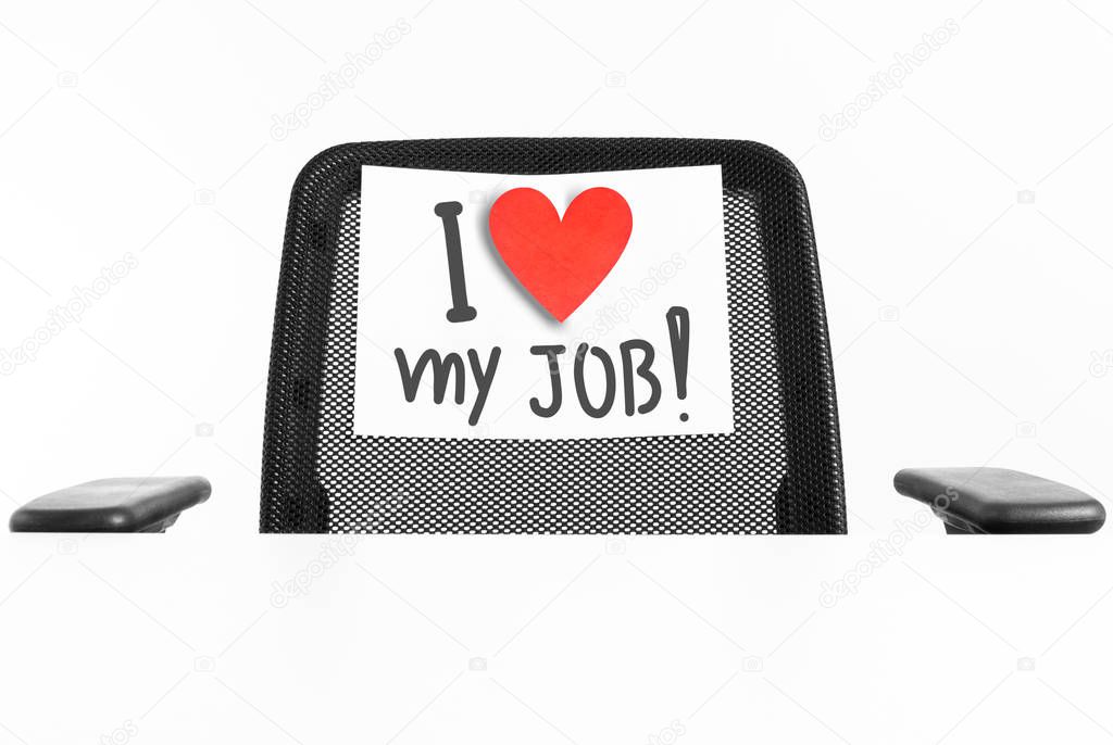 I love my job concept. Sign with a heart hanging on a chair with