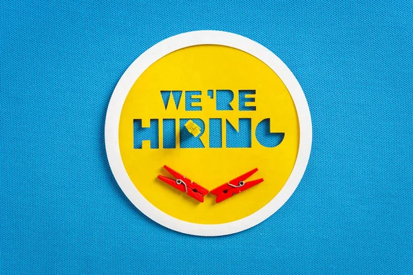 Happy we are hiring concept. Yellow button banner on blank blue