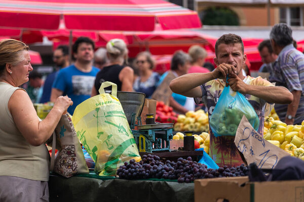 Zagreb, Croatia. 11th Aug, 2019. Locals and tourists buying groceries at the popular Dolac market in Central Zagreb