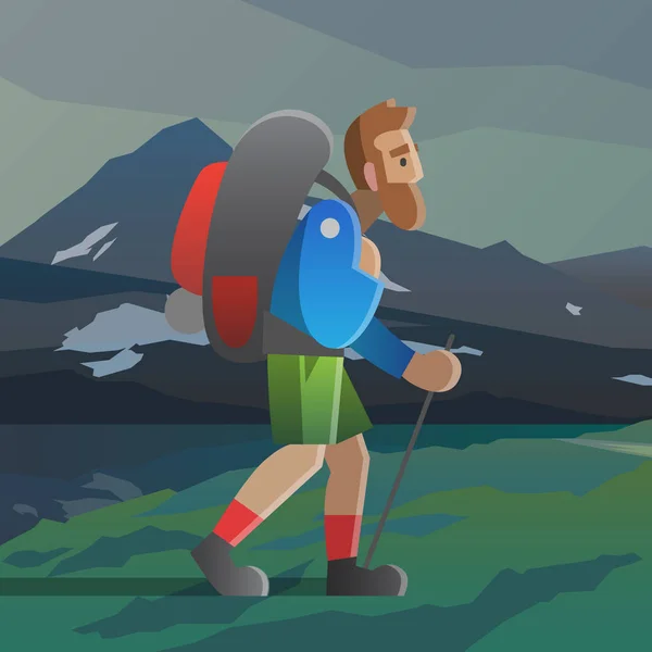 Man with big beard walking in the mountains.