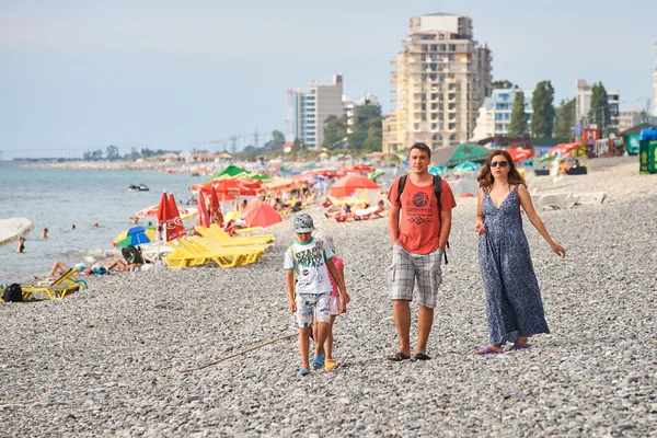Tourist family at beach in Batumi
