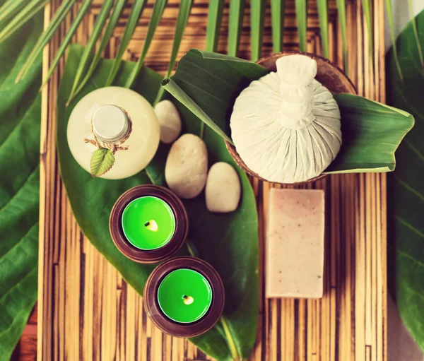 Composition with spa massage bags and candles — Stock Photo, Image