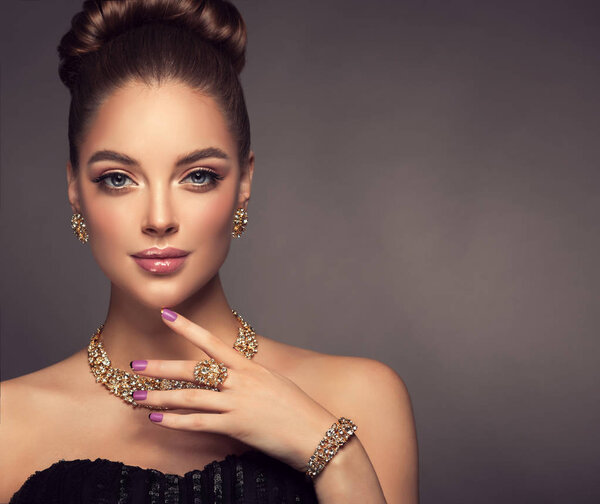 Beautiful girl with jewelry .