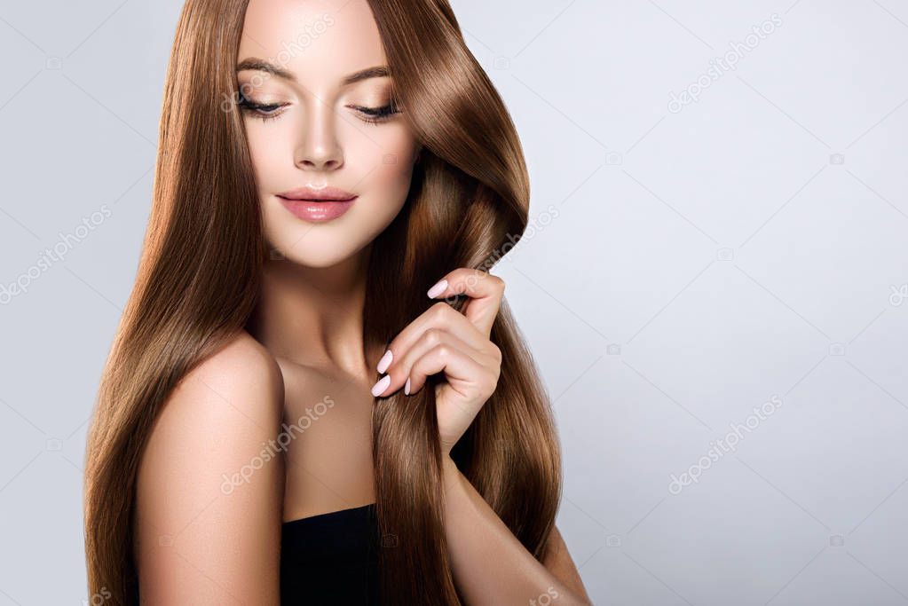girl with  brown and straight long  hair .
