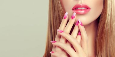 Beautiful model girl with pink ombre manicure on nails . Fashion makeup and cosmetics .  clipart