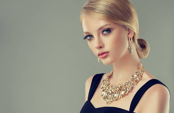 Woman in a necklace with ring