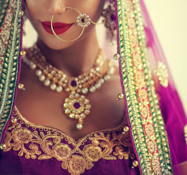 Portrait of beautiful indian girl. Young hindu woman model with kundan jewelry set. Traditional India costume lehenga choli or sari clipart