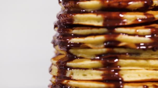 Pancakes with Chocolate Syrup, Nuts and Bananas. Stack of whole flapjack. Tasty breakfast and Healthy Food — Stock Video