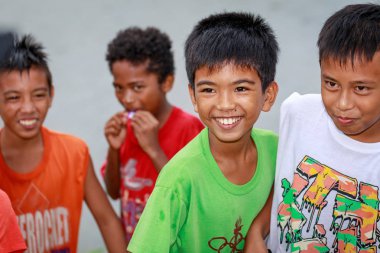 Local Filipino children living near volcano Mount Pinatubo on Au clipart