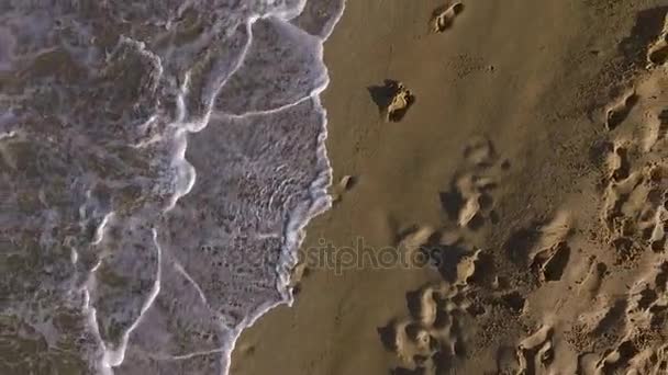 Aerial: Human footprints in the sand. — Stock Video