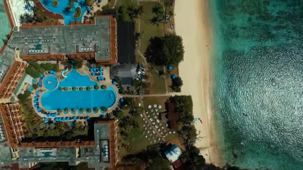 Aerial: Swimming pool on the beach. — Stock Video