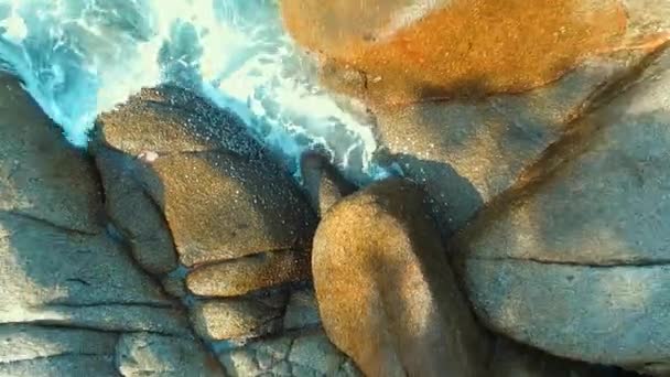Aerial: Water splash on the rocks. — Stock Video