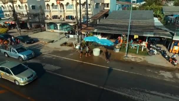 PHUKET, THAILAND April 14, 2016: Aerial: Pouring water on the Thai new year Songkran. — Stock Video